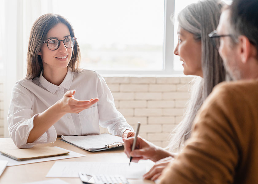 Financial advisor discussing estate planning options with a client.