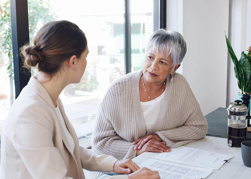 A financial advisor discussing trustee responsibilities with a client.