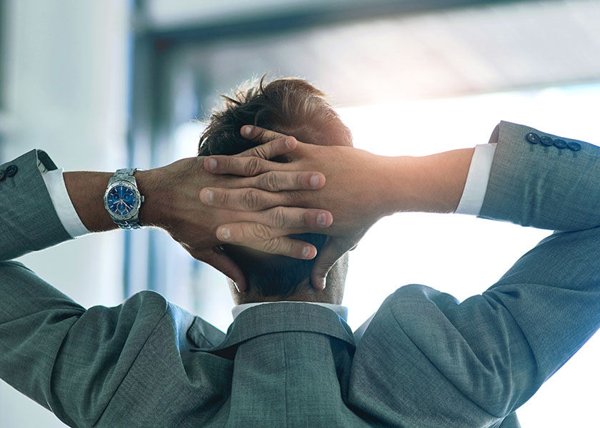 Relax, confidence and businessman with hands by head for mindfulness, idea and achievement in office. Break, success and professional male executive with pride and view in workplace for job well done